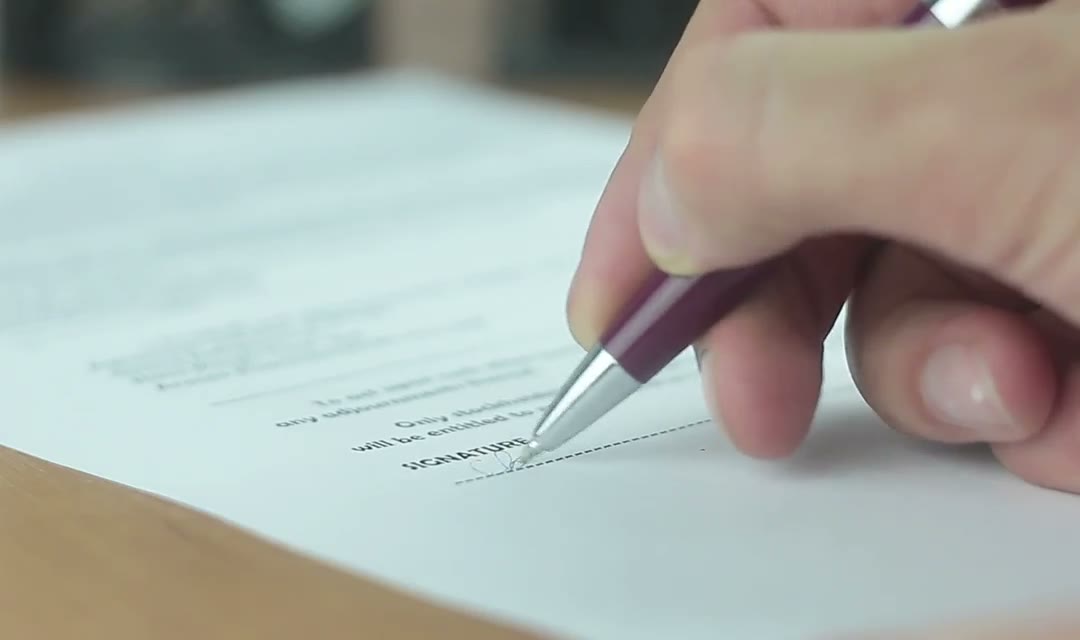 Signing an important document