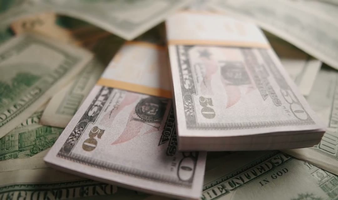 Dollars in cash on a table